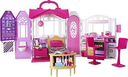 Barbie dollhouse playset with furniture and accessories.