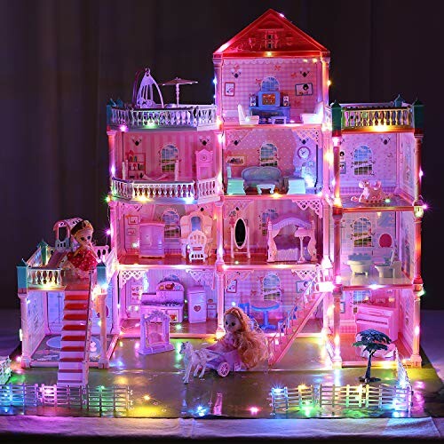 Illuminated dollhouse with multiple floors and dolls.