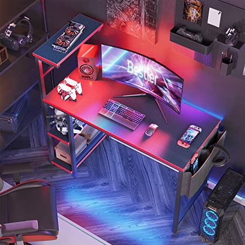 A gaming setup featuring a curved monitor, keyboard, speakers, gaming accessories, and RGB lighting on a desk.