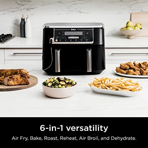 Ninja dual air fryer on kitchen counter with food