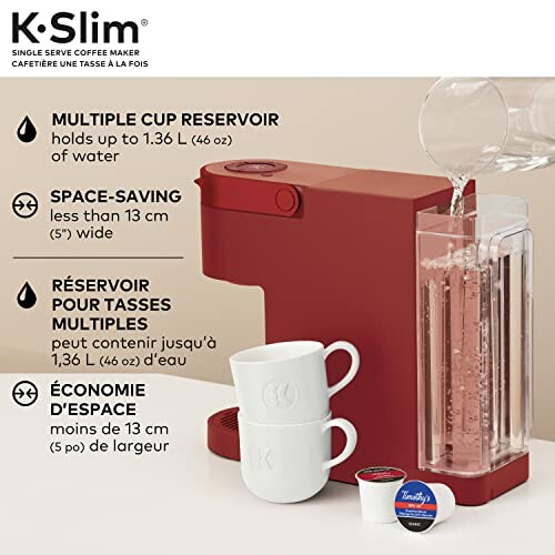 Red coffee maker with multiple cup reservoir and two white mugs.