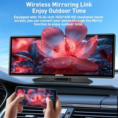 Car dashboard with wireless mirroring display showing a red flower.